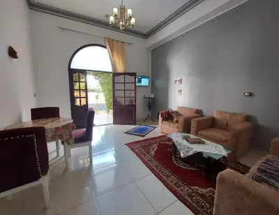 a living room with a couch and a table at Enjoy Luxor in Luxor