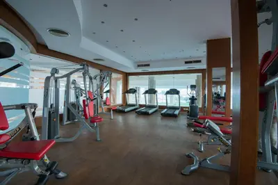 a gym with cardio equipment in a hotel room at Shams Lodge in Hurghada
