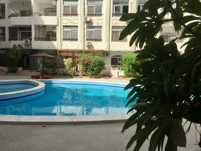 a large swimming pool in front of a building at Solider Art in Hurghada