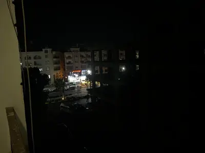 a view of a city at night from a window at Lotus compound in Hurghada