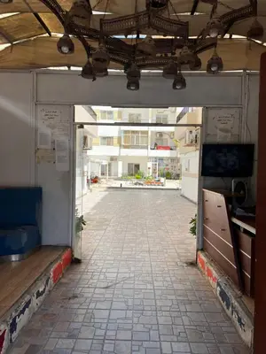 an open door into a building with a tile floor at Lotus compound in Hurghada