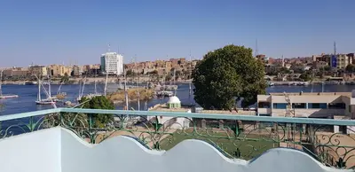 a bridge with a view of a harbor with boats at The Green Nubian House in Aswan