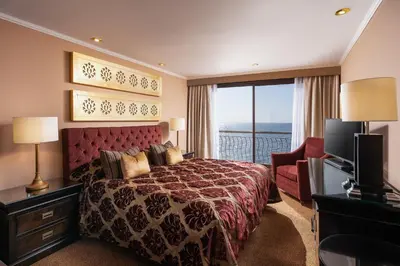 a hotel room with a bed and a television at Steigenberger Omar El Khayam Nile Cruise - Every Monday from Aswan for 07 & 04 Nights - Every Friday From Abu Simbel for 03 Nights in Aswan