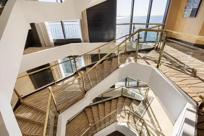 a spiral staircase in a building with a view of the ocean at Steigenberger Omar El Khayam Nile Cruise - Every Monday from Aswan for 07 & 04 Nights - Every Friday From Abu Simbel for 03 Nights in Aswan