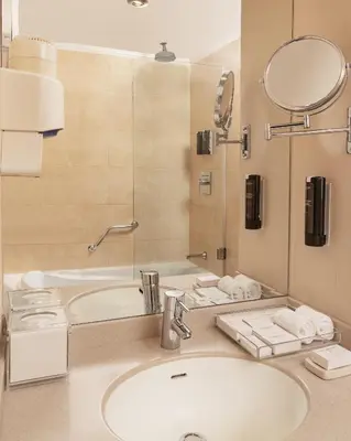 a bathroom with a sink and a mirror at Steigenberger Omar El Khayam Nile Cruise - Every Monday from Aswan for 07 & 04 Nights - Every Friday From Abu Simbel for 03 Nights in Aswan