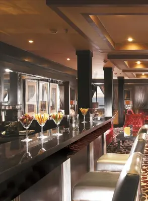 a bar in a restaurant with wine glasses at Steigenberger Minerva Nile Cruise - Every Thursday from Luxor for 07 & 04 Nights - Every Monday From Aswan for 03 Nights in Luxor