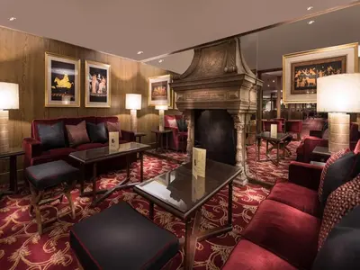 a hotel lobby with a fireplace and red furniture at Steigenberger Regency Nile Cruise - Every Saturday from Luxor for 07 & 04 Nights - Every Wednesday From Aswan for 03 Nights in Luxor