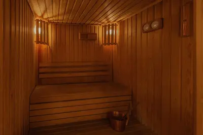 a wooden sauna with a bench and a trash can at JAZ Elite Senator Nile Cruises - Every Thursday from Luxor for 07 Nights & Every Thursday from Luxor for 05 Nights in Luxor
