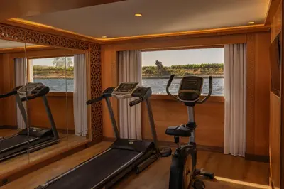 a gym with two elliptical machines and a window at JAZ Elite Senator Nile Cruises - Every Thursday from Luxor for 07 Nights & Every Thursday from Luxor for 05 Nights in Luxor