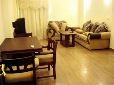 a living room with a couch and a table at Bahga Palace 2 Residential Apartments in Hurghada
