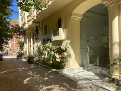 an entrance to a building with plants on a street at Bahga Palace 3 Residential Apartments in Hurghada