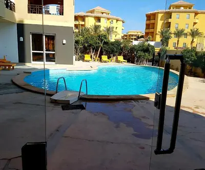 a swimming pool in the middle of a building at Apartments in Almaz Plaza in Hurghada