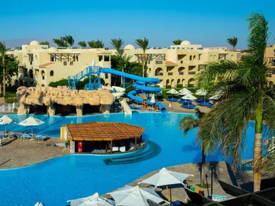 a large pool with a water slide at a resort at Stella Gardens Resort & Spa, Makadi Bay in Hurghada