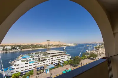 a view of a river from a building with a harbor at Philae Hotel Aswan in Aswan