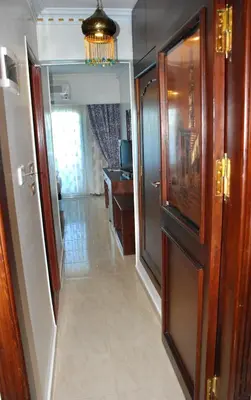 a hallway of a room with a door and a hallway at Philae Hotel Aswan in Aswan