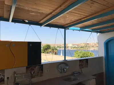a bathroom with a sink and a large window at Nubian Paradise in Aswan