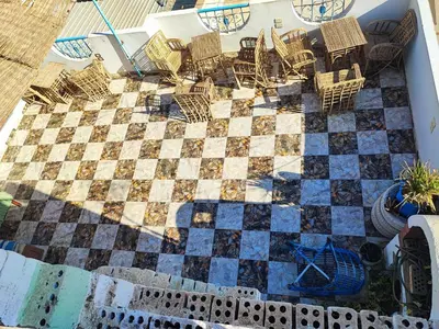 an overhead view of a chess board on a patio at Nubian Paradise in Aswan