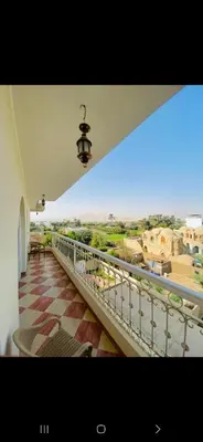 a balcony of a building with a view of the desert at Leyla Eco Resort in Luxor