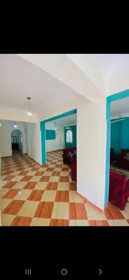 an empty living room with a checkered floor at Leyla Eco Resort in Luxor