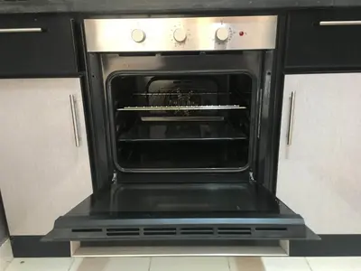 an oven with its door open in a kitchen at Pool View One bedroom Apt - B103 in Hurghada