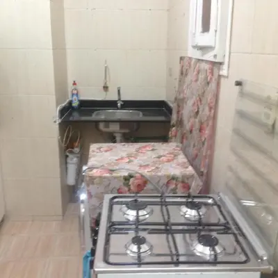 a stove in a small kitchen with a sink at Sweet Home Flat 2- 24 Hour open in Hurghada