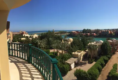 a bridge over a garden with a view of a city at El Gouna Abu Tig Marina OV3550 in Hurghada