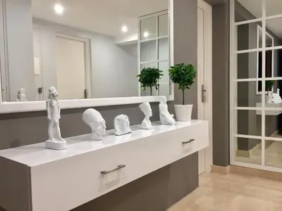 a bathroom with a white counter with a mirror at El Gouna Abu Tig Marina OV3550 in Hurghada
