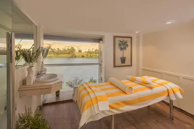 a bedroom with a bed and a sink and a window at Sonesta Star Goddess Cruise - Luxor- Aswan - 04 & 07 nights Each Saturday in Luxor