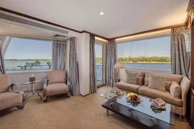 a living room with a couch and a table at Sonesta Star Goddess Cruise - Luxor- Aswan - 04 & 07 nights Each Saturday in Luxor