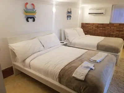a bedroom with two beds with towels on it at One Bedroom Chalet managed by Lilly Homes in Hurghada