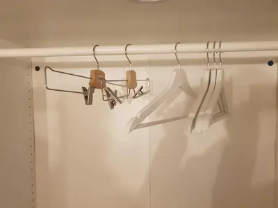 a closet with two hangers and a shower curtain at One Bedroom Chalet managed by Lilly Homes in Hurghada