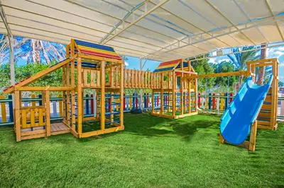 a row of playground equipment with a slide at Sunrise Aqua Joy Resort in Hurghada