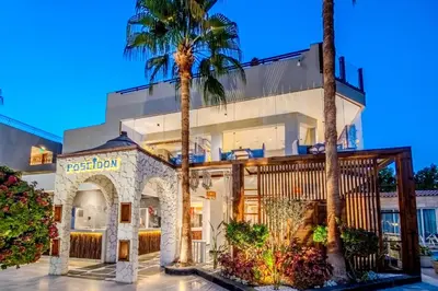 a building with palm trees in front of it at Sunrise Aqua Joy Resort in Hurghada