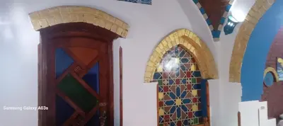 two doors in a church with stained glass windows at Golden Palace Garden in Luxor