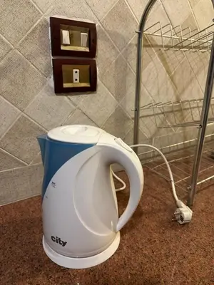 a toaster sitting on a counter next to a basket at Harmony House Luxor in Luxor