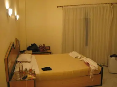 a bedroom with a bed in a room with a window at Diana Hotel Hurghada in Hurghada