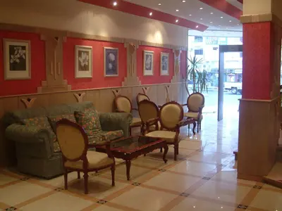 a waiting room with chairs and a couch and a table at Diana Hotel Hurghada in Hurghada