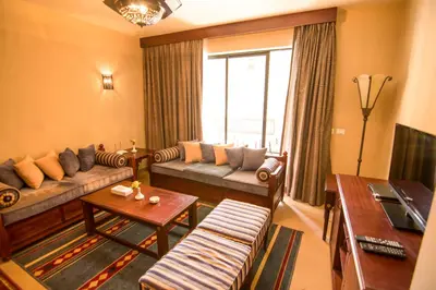 a living room with a couch and a table at Marina Residence Suites Port Ghalib in Port Ghalib