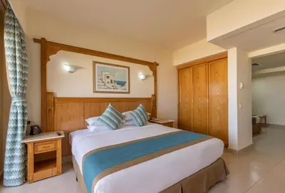 a bedroom with a large bed in a room at Hurghada Long Beach Resort in Hurghada