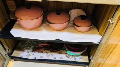 a cupboard with pots sitting on top at Apartment in Center of Hurghada in Hurghada