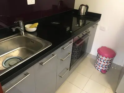 a kitchen with a sink and a counter at One bedroom Apt at The View - B104 in Hurghada
