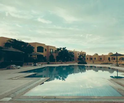 a swimming pool in the middle of a resort at One bedroom Apt at The View - B104 in Hurghada