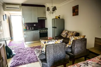 a living room with two couches and a kitchen at Studio at Hurghada- NS2 in Hurghada