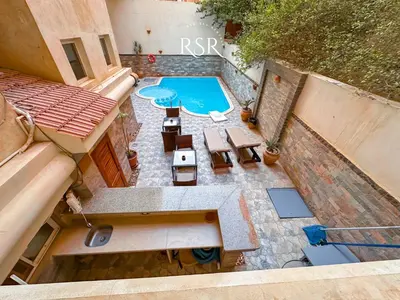 an overhead view of a patio with a swimming pool at Elite Suites Hurghada in Hurghada