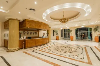 a lobby of a hotel with a chandelier at Imperial Shams Abu Soma in Hurghada