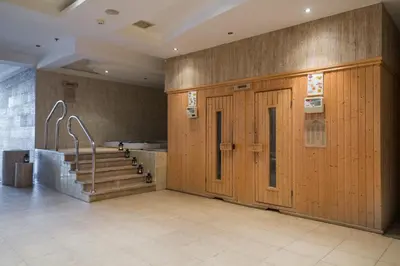 a large room with a staircase and a wooden door at Shams Safaga Resort in Hurghada