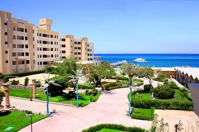a view of a resort with the ocean in the background at King Tut Aqua Park Beach Resort in Hurghada