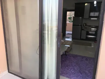 an open door to a kitchen with a refrigerator at Studio Sea view At Hurghada - A105 in Hurghada