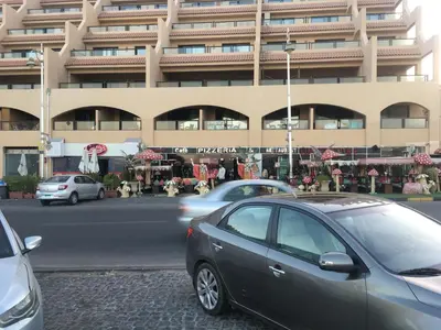 a car parked in front of a large building at Studio Sea view At Hurghada - A105 in Hurghada