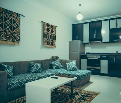 a living room with a couch and a table at Studio Sea view At Hurghada - A105 in Hurghada